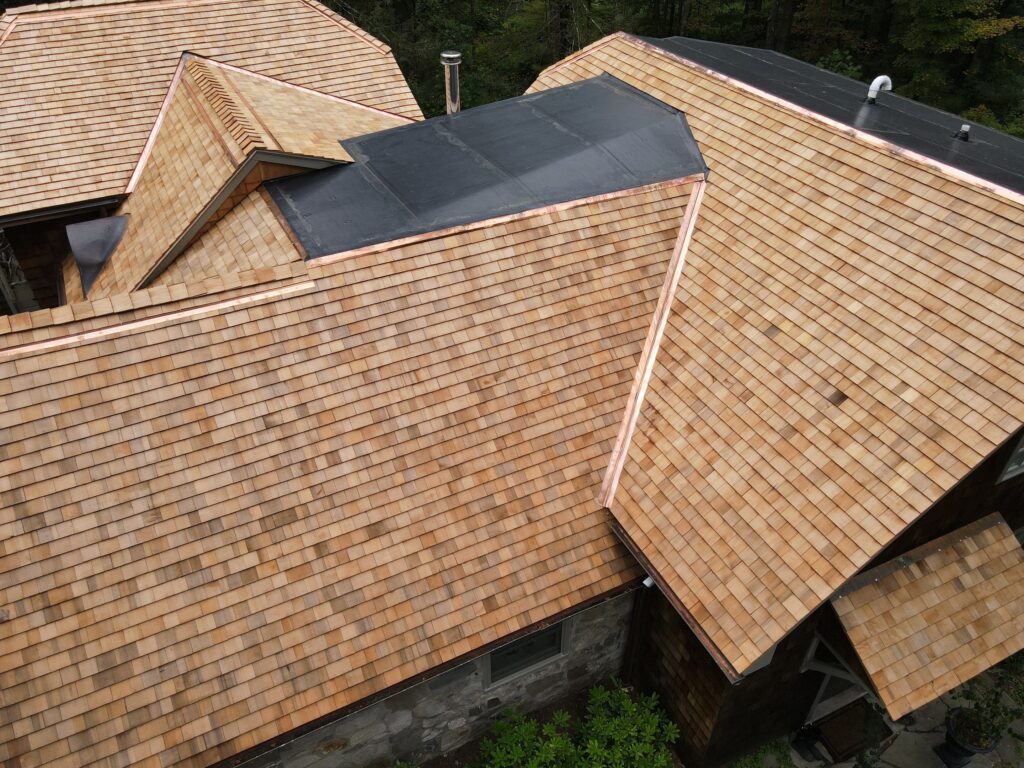 Cedar Roof Replacement with copper valleys in Redding CT. Done by the best roofing contractor in the area.